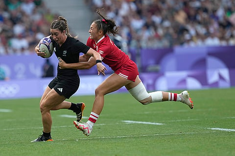 Jazmin Feliz-Hotham, left is tackled by Florence Symonds 